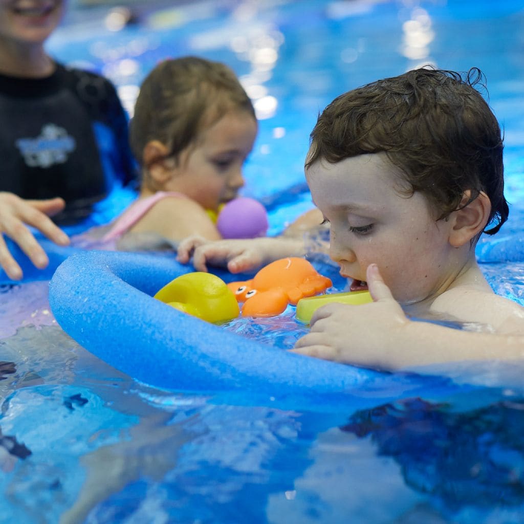 kids-learning-to-swim-floats-kids-swimming-lessons-chertsey-river-bourne-club